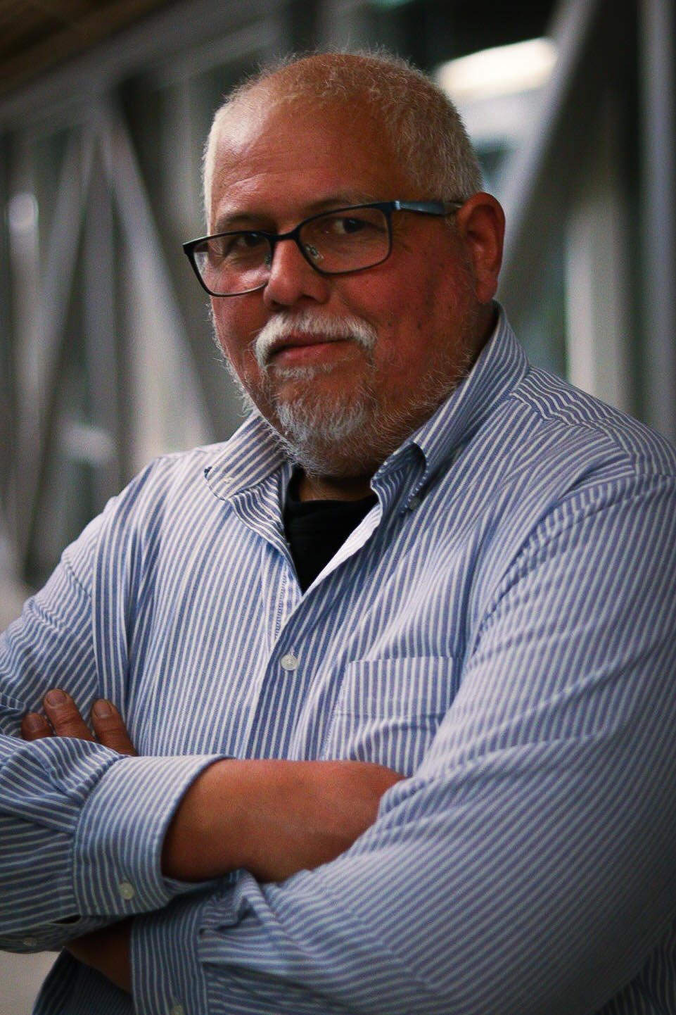 Portrait of Uvernes A. Somarriba Vaughan, MSCS standing in a modern architectural setting